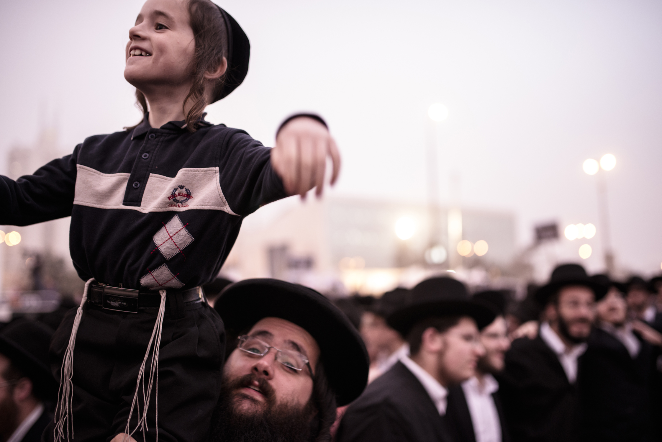 A father lifts his son as hundreds of thousands of Ultra Orthodox Jews demonstrate in Jerusalem against any plans to make them undergo military service. The protests were sparked by cuts in government funding to Jewish theological seminaries, or yeshivas, and a planned crackdown on young ultra-Orthodox men seeking to avoid Israel's compulsory military draft. The picture was taken in Jerusalem, Israel, 2nd Mar 2014.
