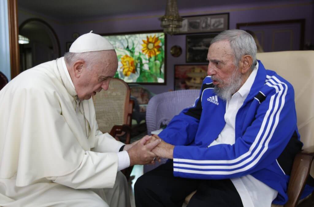 In this Sunday, Sept. 20, 2015 photo, Pope Francis holds hands with Fidel Castro in Havana, Cuba. The Vatican described the 40-minute meeting at Castro's residence as informal and familial, with an exchange of books. (AP Photo/Alex Castro) |